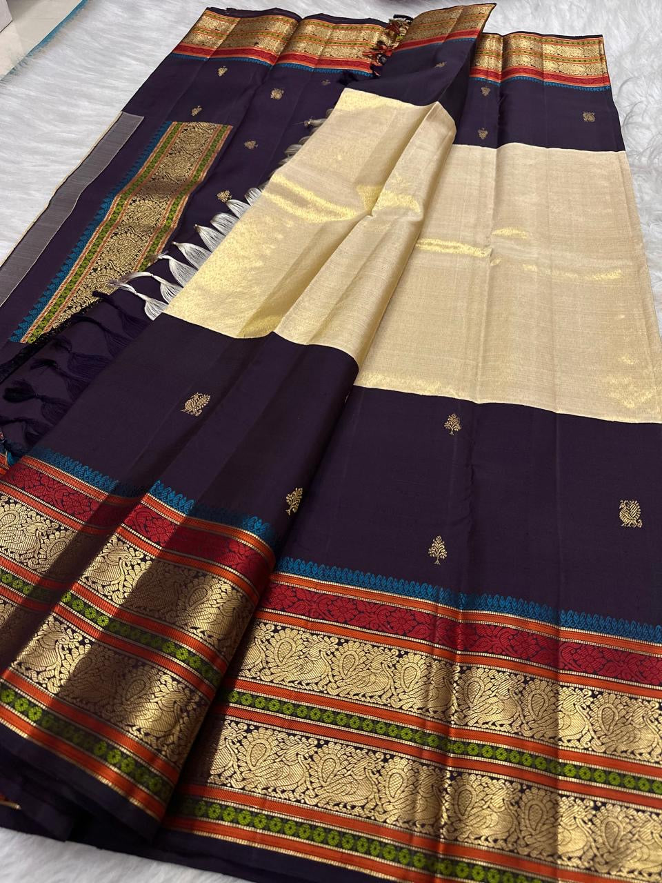 Traditional Annapakshi motif woven in gold zari on tissue Kanchipuram saree