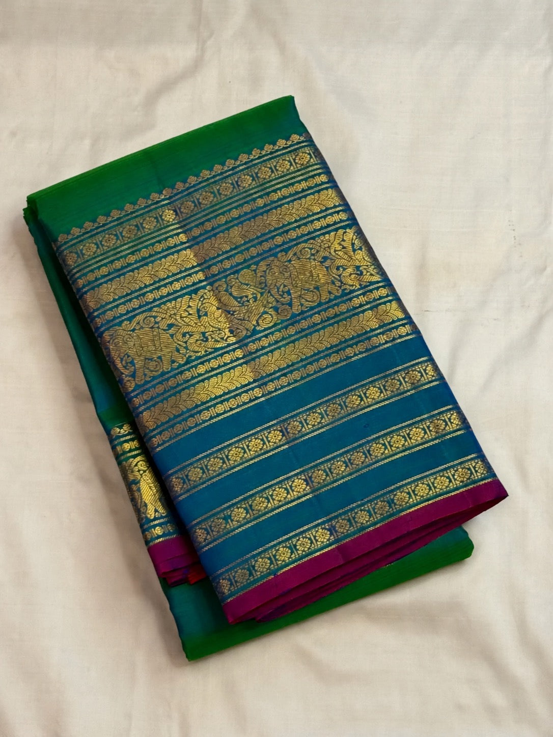 Iridescent peacock-neck blue and green pure silk Kanchipuram saree, mayil kazhuthu handwoven kanjipuram silk; traditional Varisaipet weave.