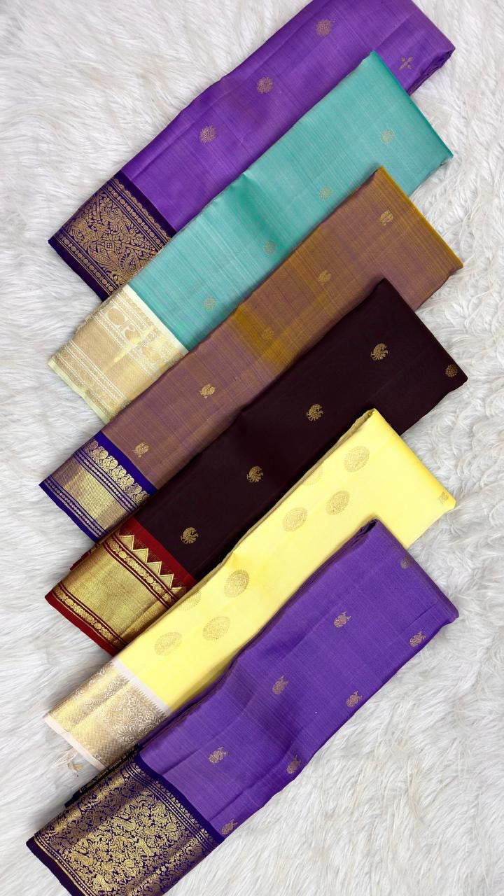 Ivory Kanchipuram border with twin Mayil gold-zari motifs