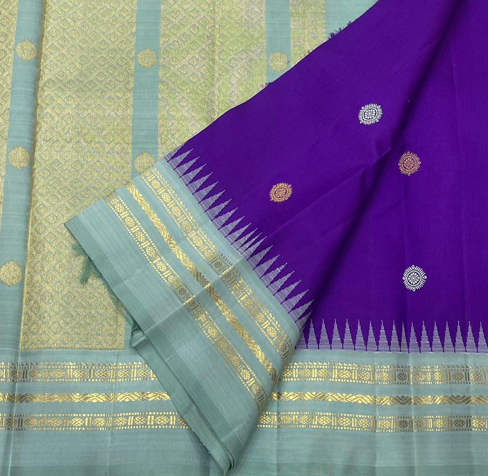 Ice blue Korvai Varisaipet border of royal violet blue Kanjeevaram saree with Kaal Irangiya temple edge and antique gold zari