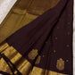 Deep chocolate brown Kanjipuram silk saree folded showing Maanga paisley butta body and ornate self-colour gold zari border