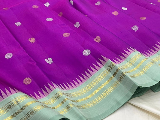 Orchid purple Kanjipuram silk saree body close-up showing Mayil Chakram circular peacock medallion buttas in coloured silk thread