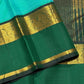 Light Green Handwoven Korvai Kanjivaram Silk Saree with Bottle Green Border