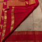 Close-up of gold zari floral medallion buttas on Biscuit Beige Kancheepuram silk saree body