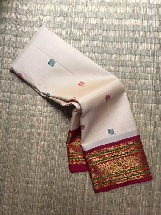 Handwoven Korvai Kancheepuram silk saree, Varisaipet border with floral buttas close-up