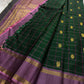 Maragatham-green handwoven Kanchipuram saree showing geometric zari grid and traditional buttas.