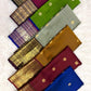 Handwoven mustard Kanchipuram saree showing the peacock and floral kodi border.