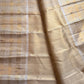 Pale gold handwoven Pure Silk Kanjeevaram Butta saree with orange Meenakari Kamalam motifs and coral-orange selvedge, body weave detail