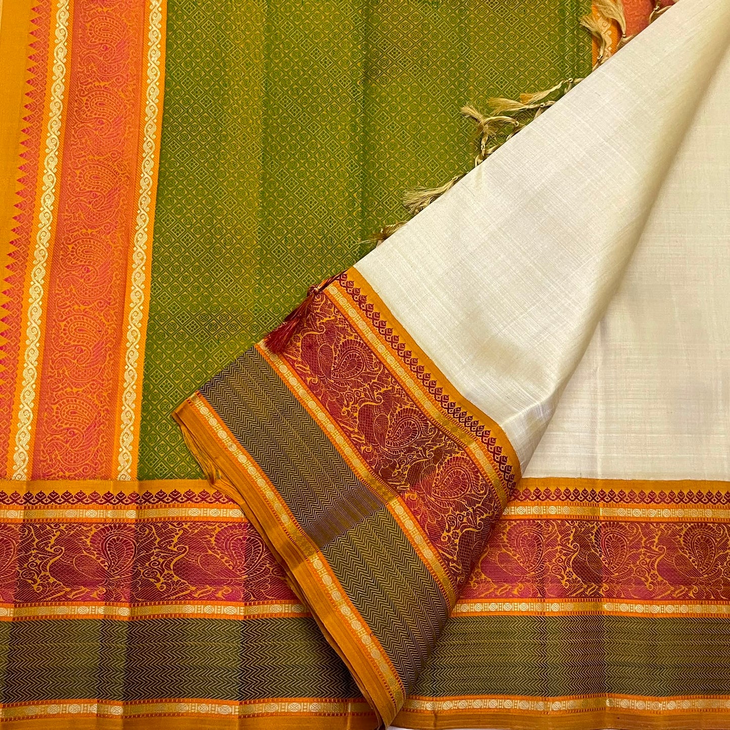 Handwoven Pattupet pure silk saree in warm ivory, folded view