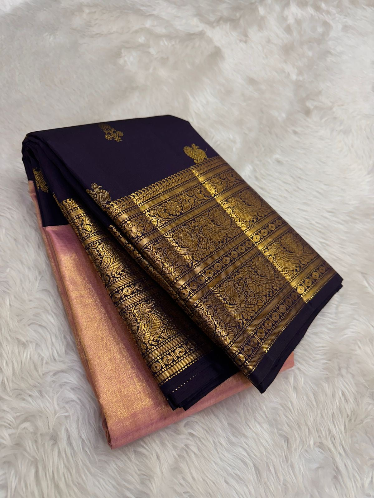 Handwoven pink tissue silk KanchiPattu Korvai saree, folded view