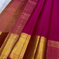 Raspberry pink Kanjeevaram saree draped showing zari kattam weave