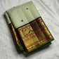 Dark silk thread mayil chakram butta on pistachio green Kanchi Pattu silk saree body — Idam Living