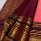 Coral Peach Kanchi Pattu silk saree with aubergine border detail