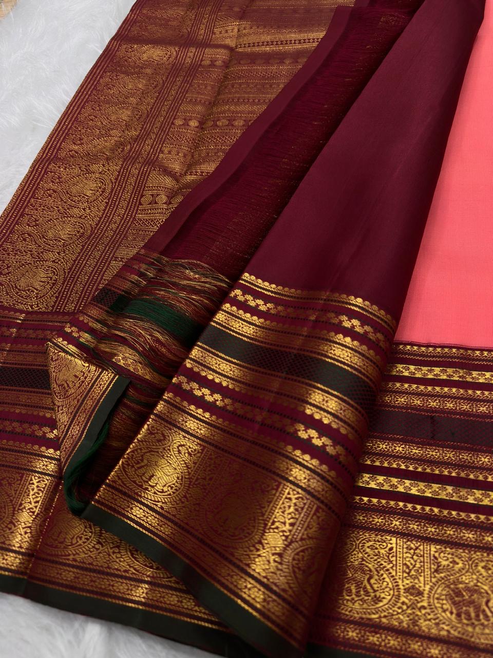 Coral Peach Kanchi Pattu silk saree with aubergine border detail
