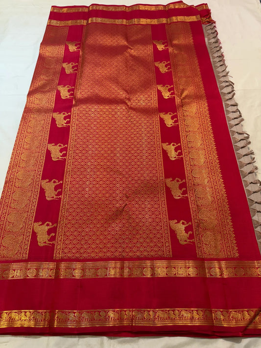 Raspberry red Rettapet border with gold zari elephant motifs on Biscuit Beige Kancheepuram Korvai silk saree