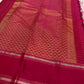 Front view of the raspberry pink KanchiPattu saree with its dense 1000 Butta weave.