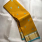 Golden Turmeric Kancheepuram silk saree with robin egg blue Mayil-Yaanai buttas — Idam Living