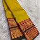 Turmeric Gold Kanjivaram silk saree with raspberry Korvai border