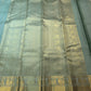 Handwoven dewdrop sage green Kanjeevaram saree with Zari Kattam weave.