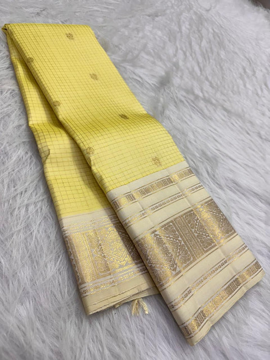 Butter Yellow pure silk Kanchipuram saree, Varisaipet weave with Ivory Gold Zari border — body weave close-up