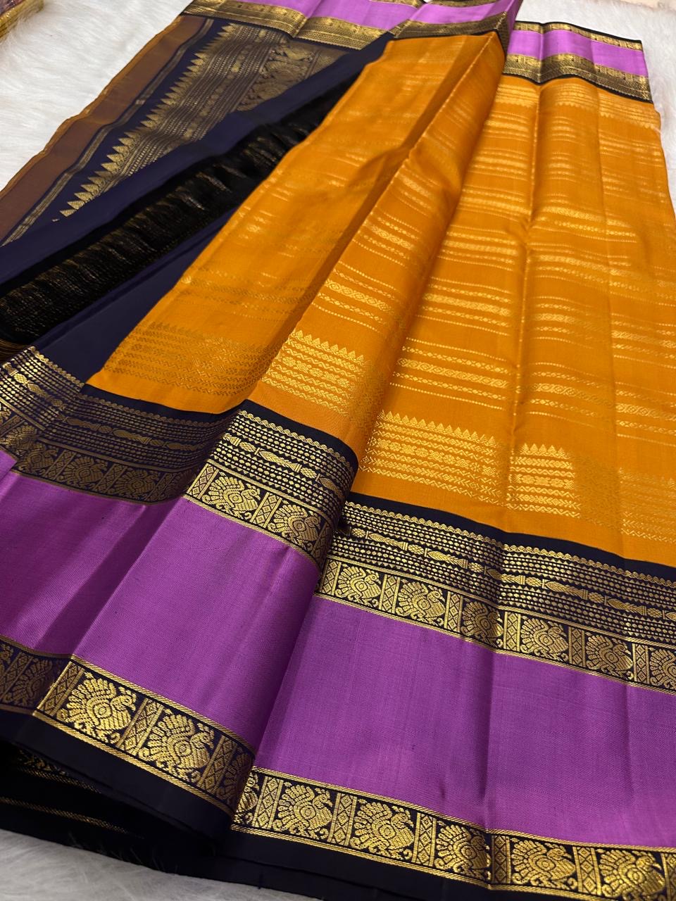 Saffron Marigold Handwoven Pure Silk Kanjipuram Korvai Saree with Orchid Purple Border and Veldhari Zari