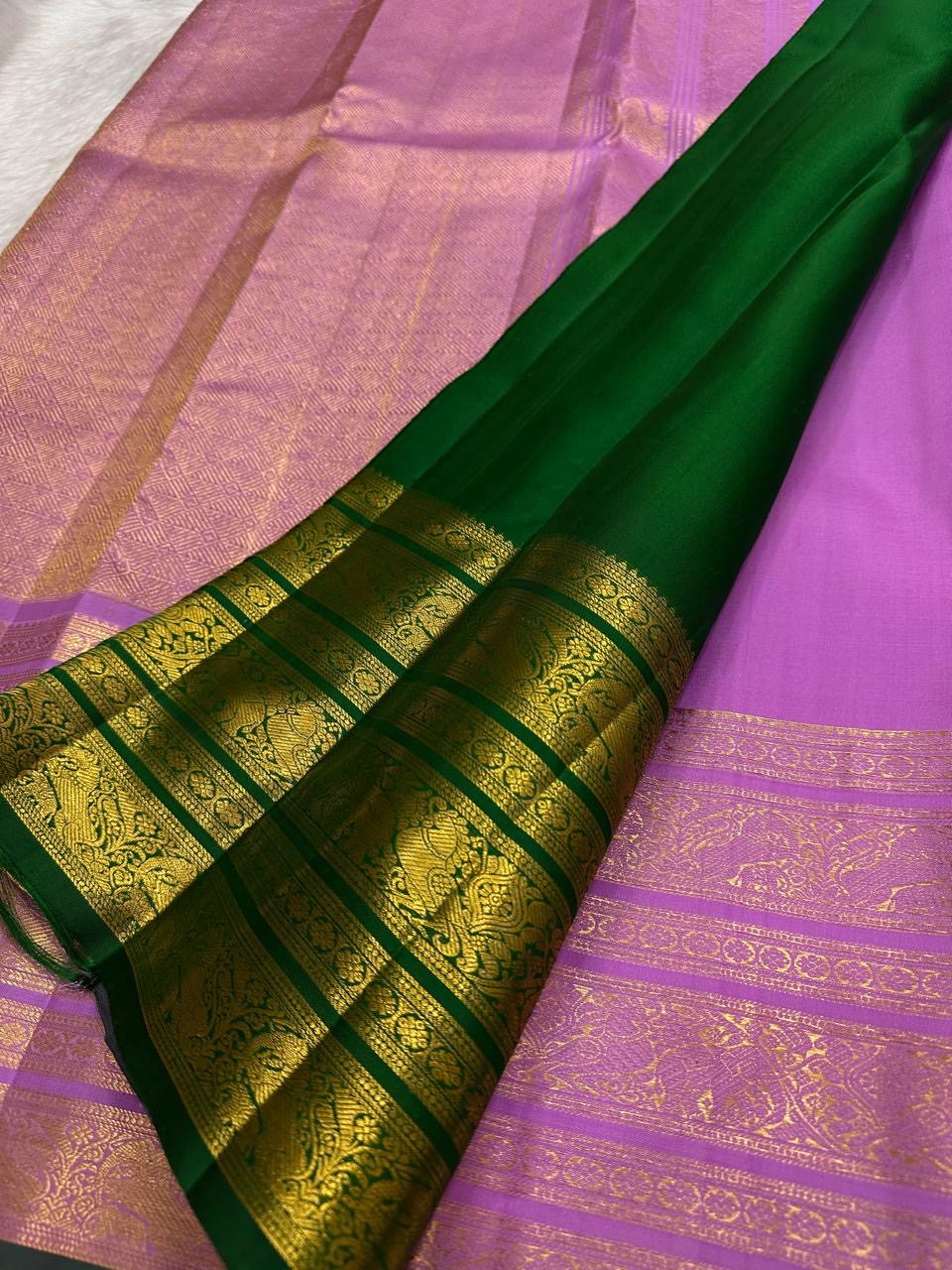 Varisaipet border registers in rose-gold zari on a handwoven pure silk Kanchipuram saree