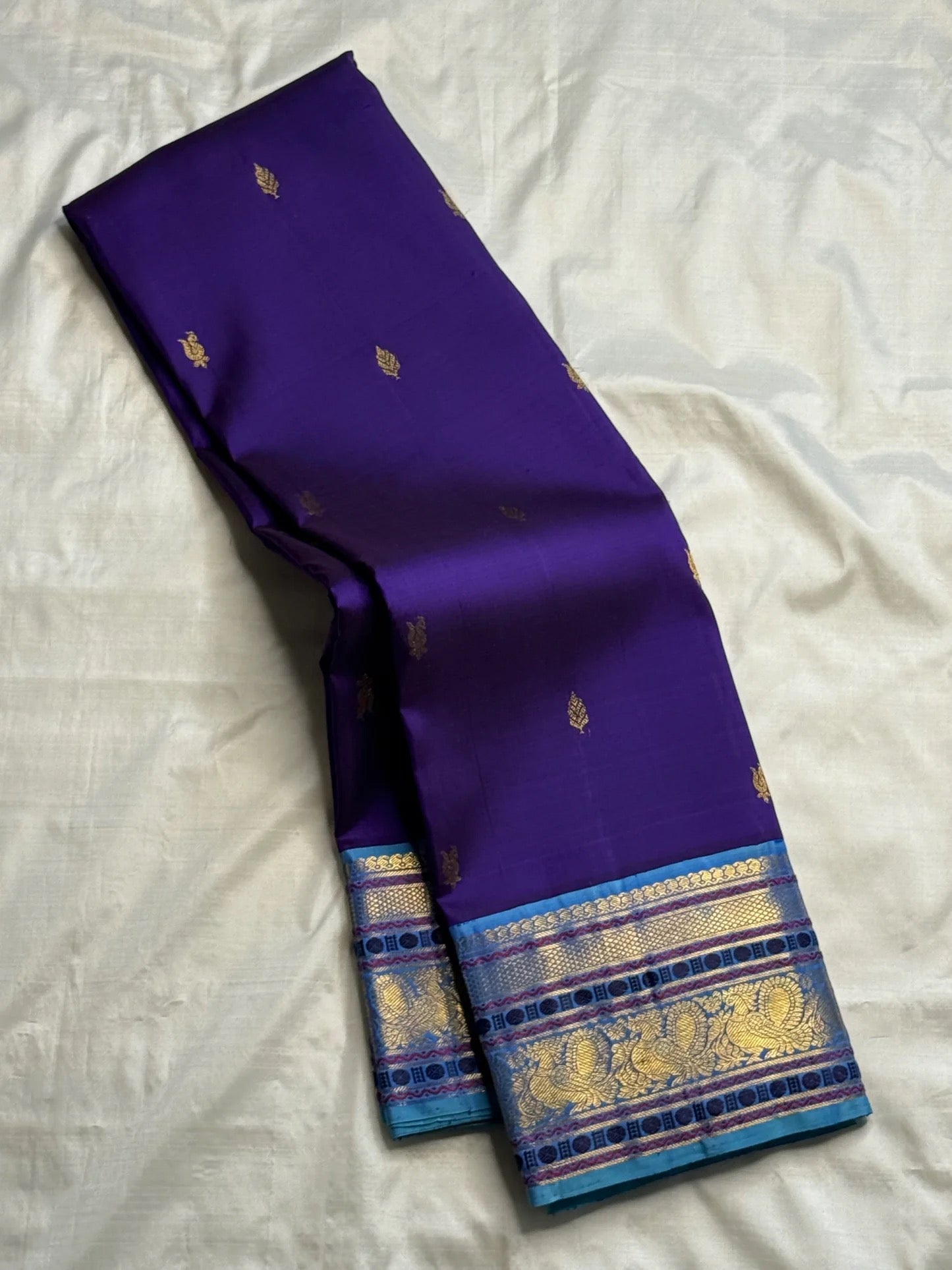Handwoven purple Kancheepuram silk saree — antique-gold zari butta detail
