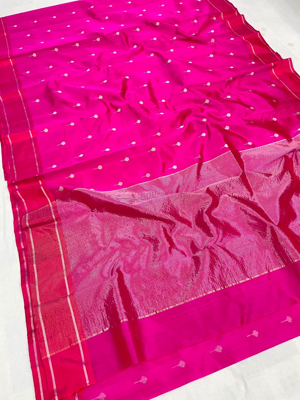 Handwoven Rani pink Chanderi saree with zari buttas across the body