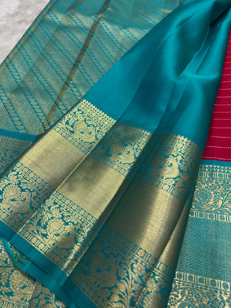 Raspberry Pink pure silk Kanjeevaram saree, Korvai weave with Peacock Teal Zari border — border detail