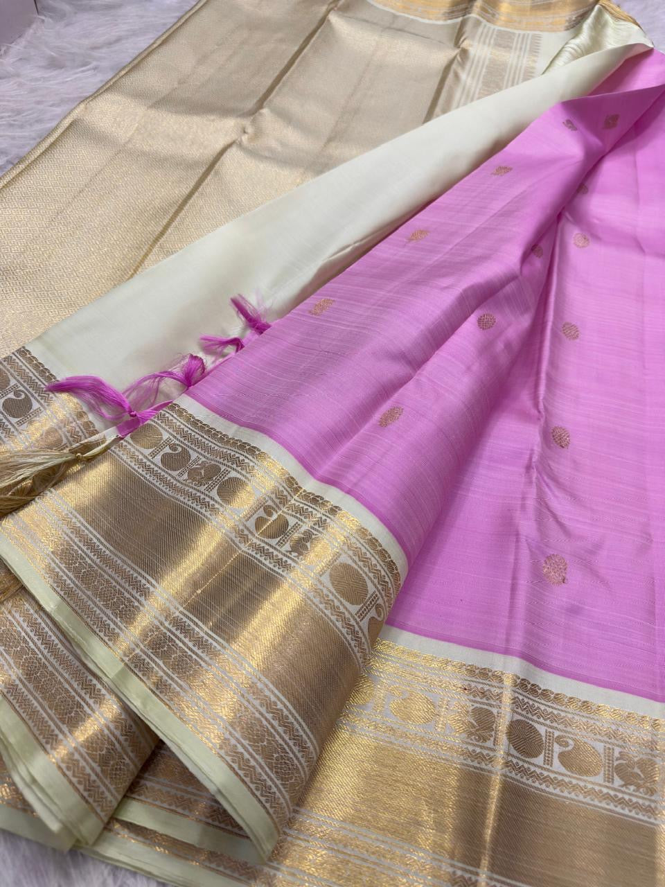 Rose Pink handwoven Kanchipuram saree with broad ivory and gold contrast border
