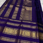 Handwoven royal violet Kanchipattu saree with Rettapet zari border, folded view.