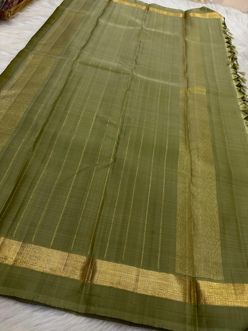 Olive Green Handwoven Pure Silk Kancheepuram Saree with Plain Body and Sage Green Zari Border