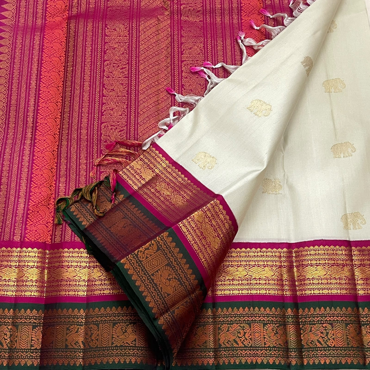 Sandalwood Ivory Handwoven Pure Silk Kanjivaram Korvai Saree with Peacock and Elephant Motifs, woven motif and zari detail