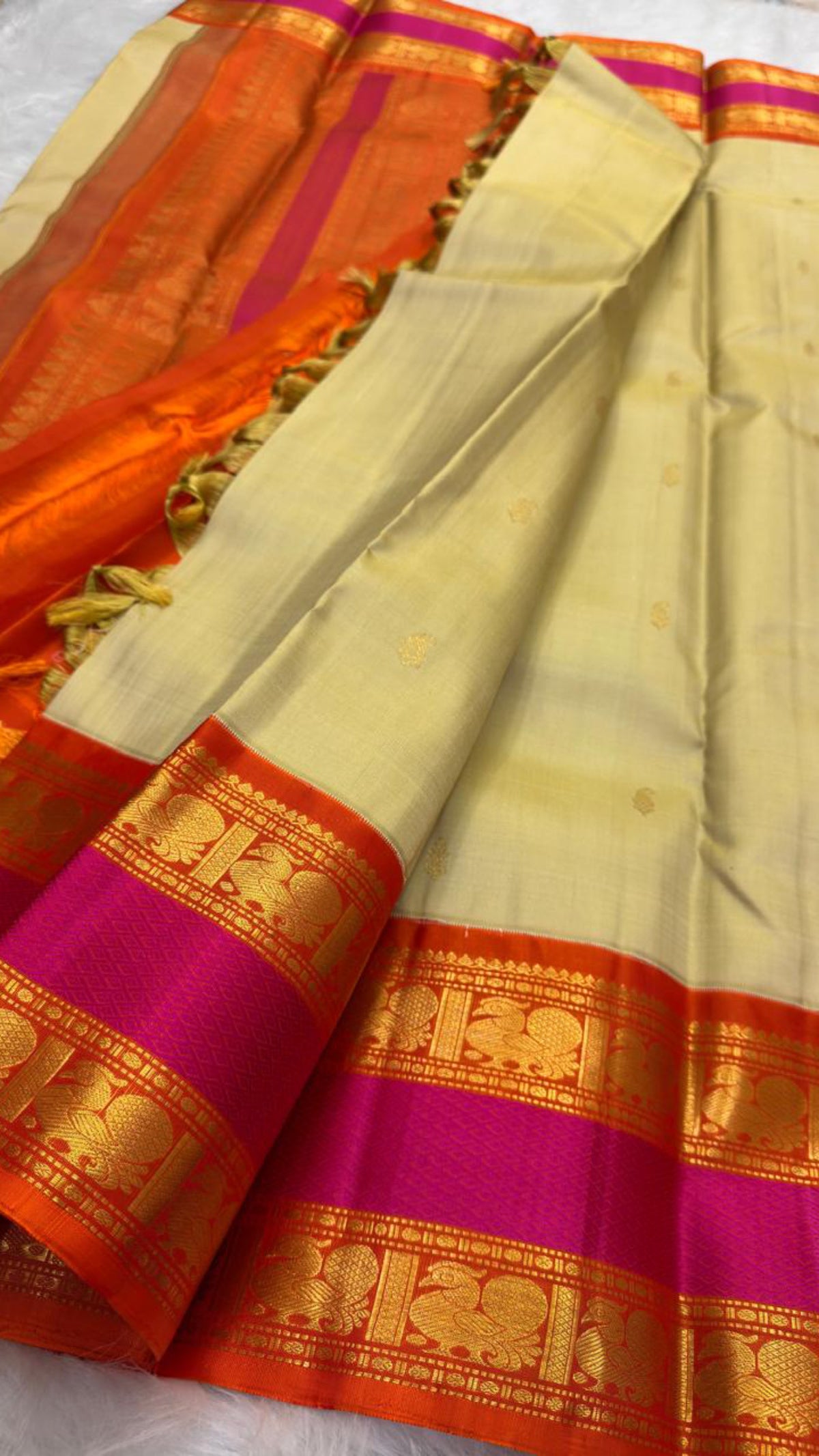 Full textile view of Chandanam Pure Silk Kanchipuram saree with maanga buttas and layered Rettapet border.