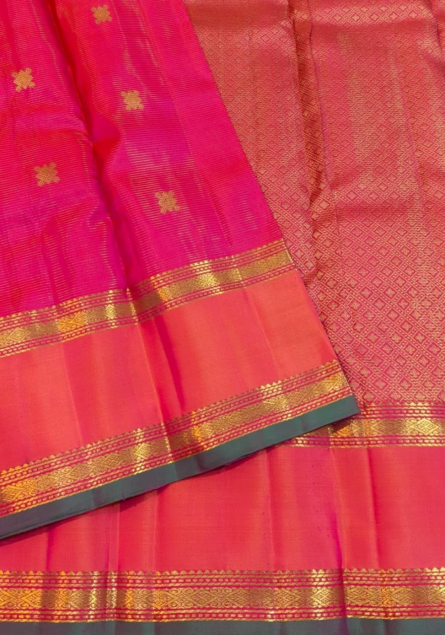 Raspberry Pink Handwoven Pure Silk Kanchipuram Rettapet Saree with Orange Double Border — close-up of body zari buttas