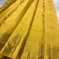 Full view of Manjal yellow handwoven Kanchipuram silk with Kamalam buttas and detailed zari border.
