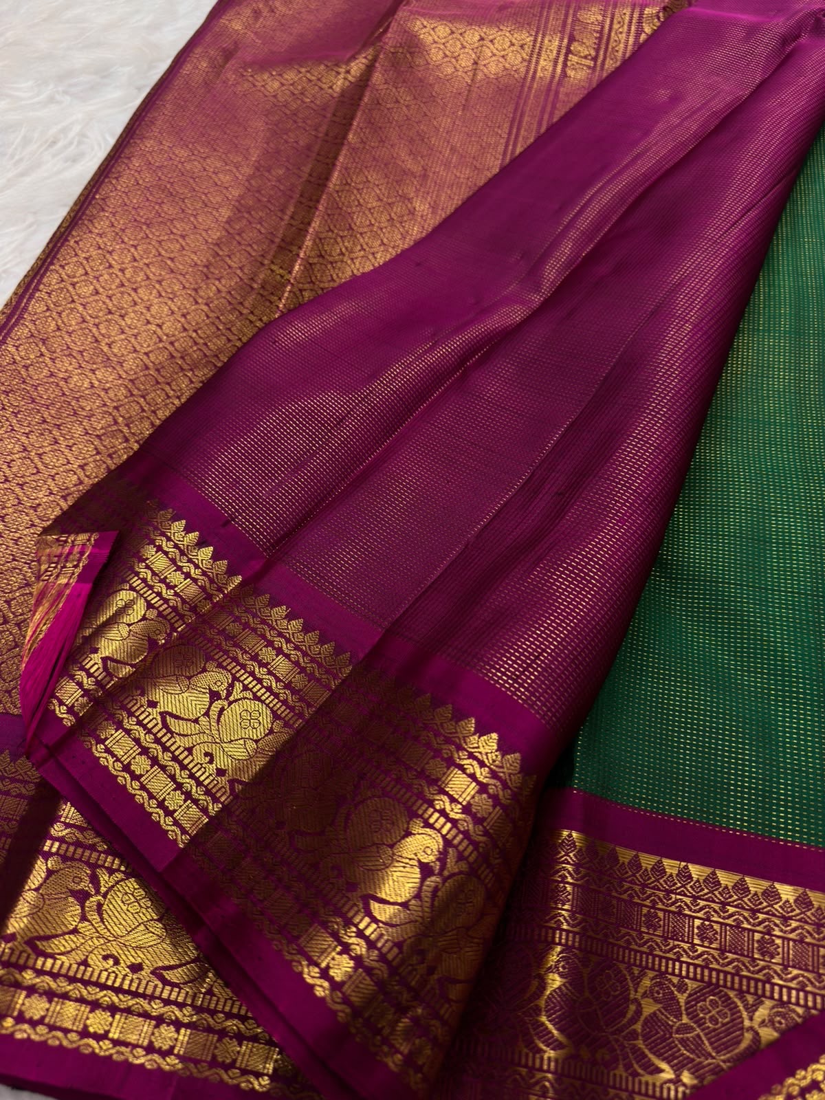 Emerald-green pure silk KanchiPattu Vairaoosi saree, folded view — Idam Living