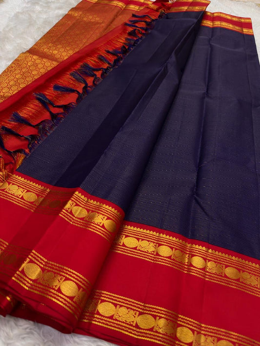 Vairaoosi weave close-up on deep navy KanchiPattu silk saree body, needle-like zari shimmer