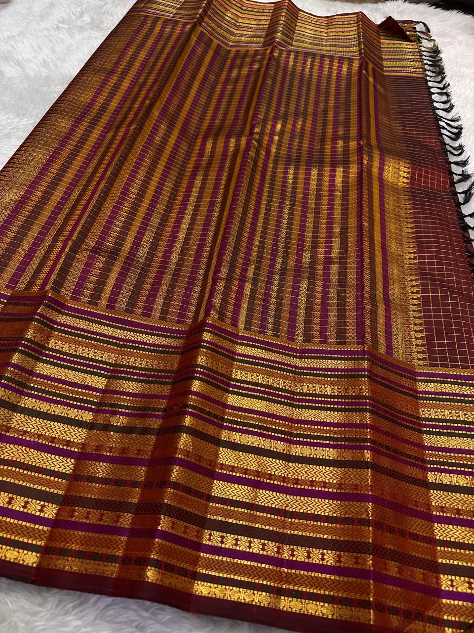 Handwoven Varisaipet border detail on the deep cocoa maroon Kanjivaram silk saree