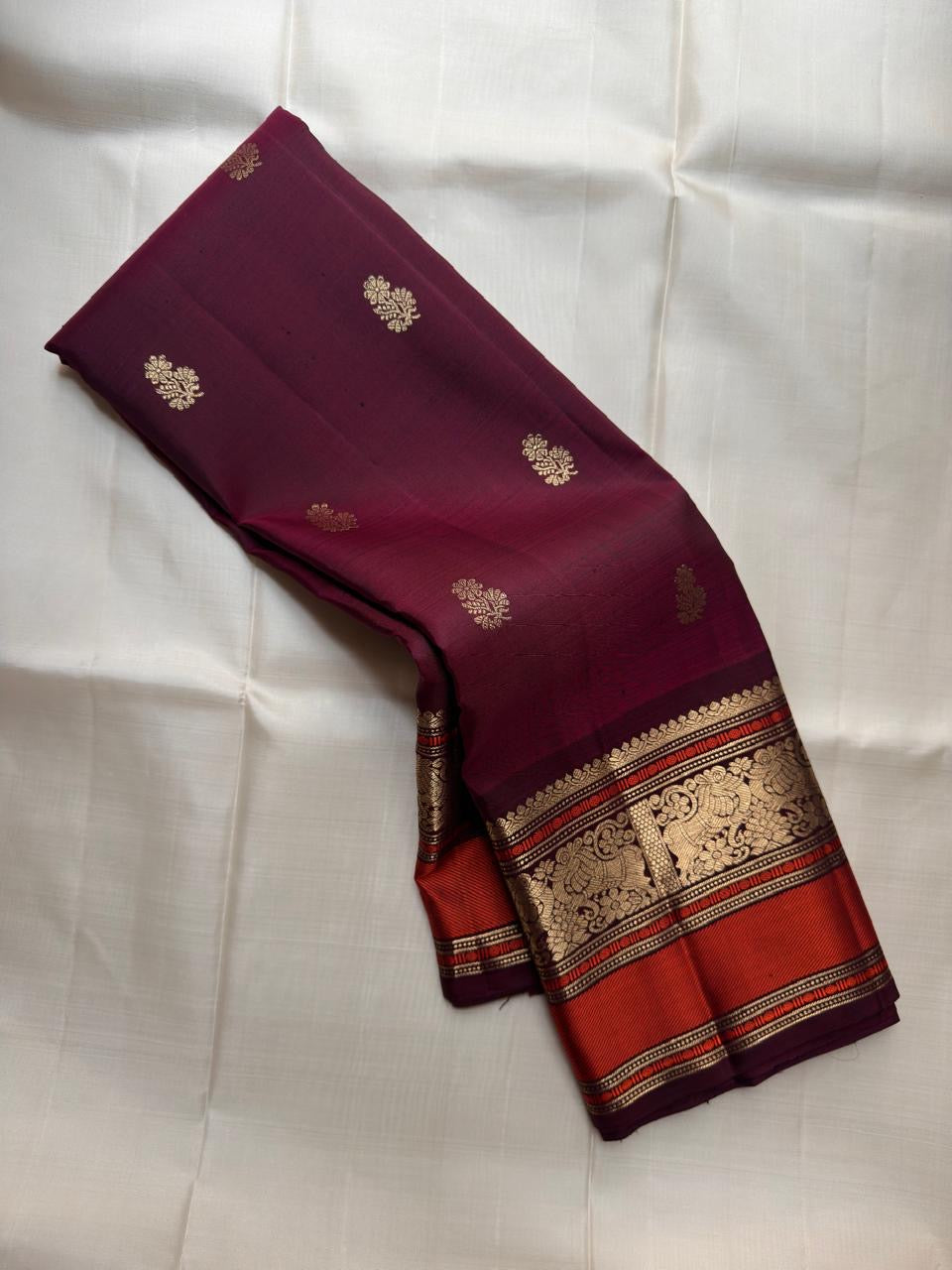 Vermilion Red pure silk Kanjivaram saree, Butta weave with Deep Aubergine border — full drape view