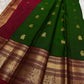 Handwoven vintage green Kanchipuram saree with gold zari and Arakku contrast.