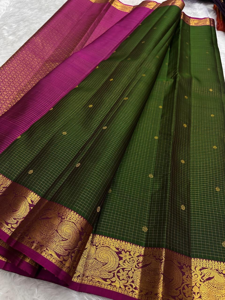 Forest green and raspberry pink Kanchipuram saree pallu detail