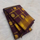 Handwoven Zari Kattam saree in deep aubergine with Mayil Chakram motifs, folded view