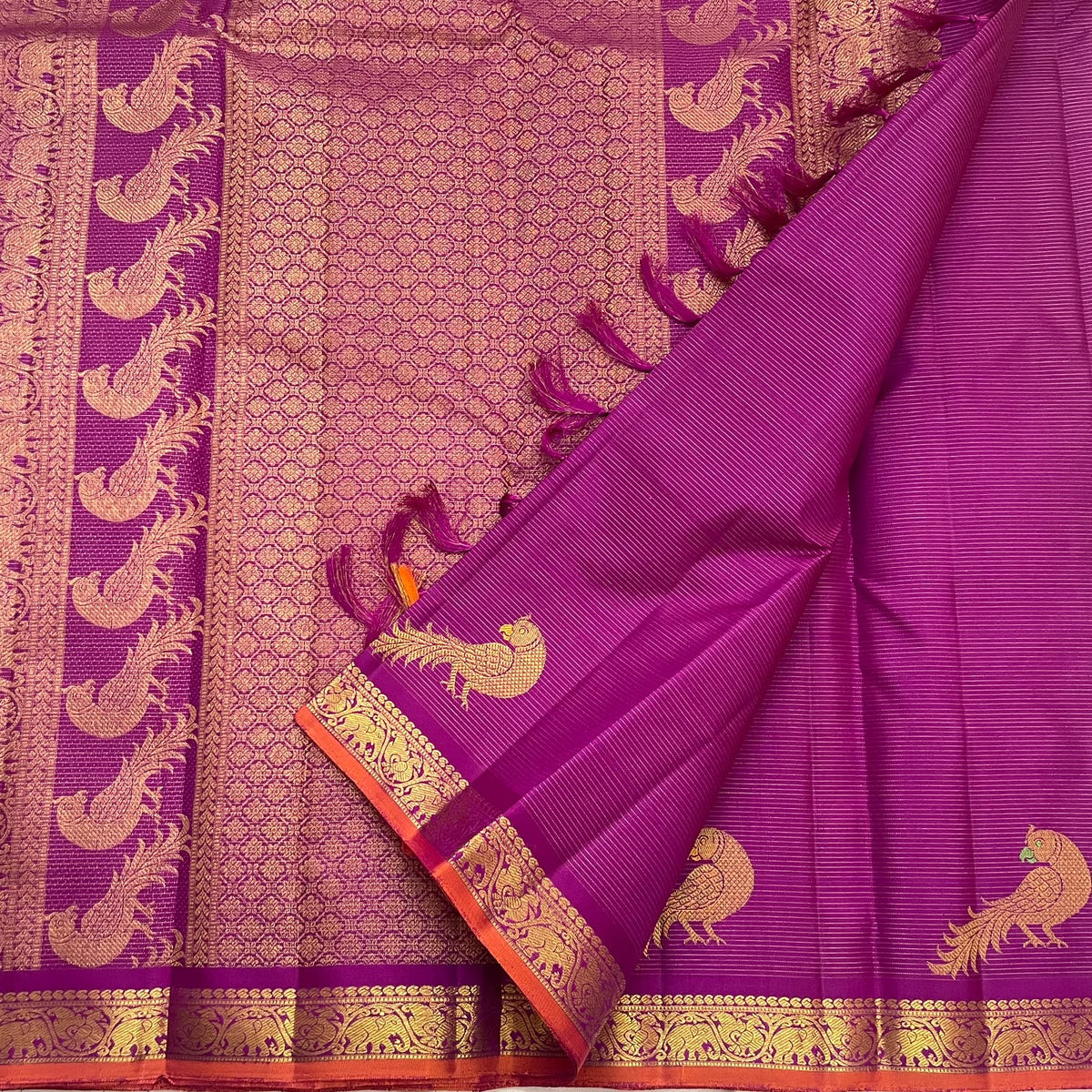 Kathiripoo magenta-purple Kanchipuram silk saree showing closely set Vairaoosi zari lines and gold Kili motifs