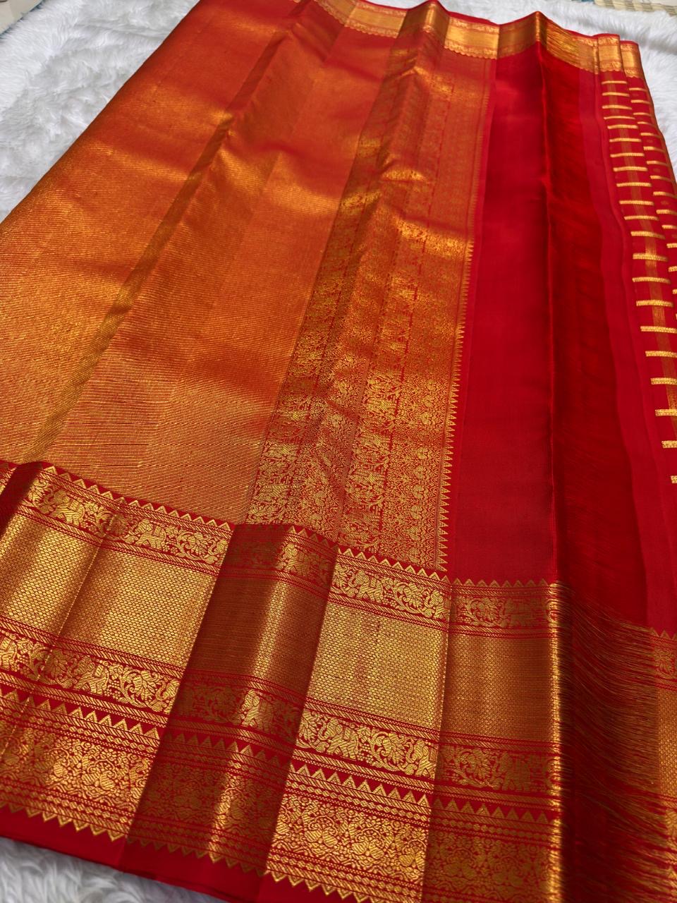 Vermilion Red Gold Checks pure silk Kanchipuram saree, pallu full, showing brilliant kumkum red, warm vermilion orange highlights and glowing yellow-gold zari