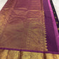 Purple Kancheepuram silk saree with richly woven traditional mayil border