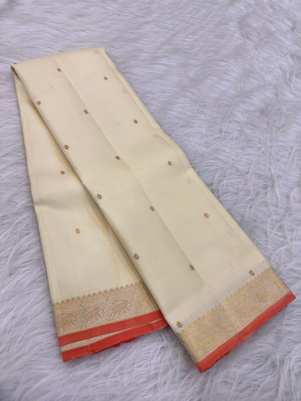 Ivory Handwoven Pure Silk Kanjivaram Saree with Small Gold Buttas & Petite Zari Elephant Border