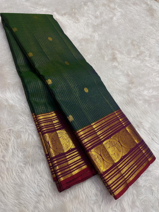 Emerald green Kanchipuram silk saree featuring classic gold zari kattam grid pattern