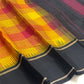 Turmeric yellow handwoven pure silk Kanjivaram Kanchi Kattam saree with black pallu, full view