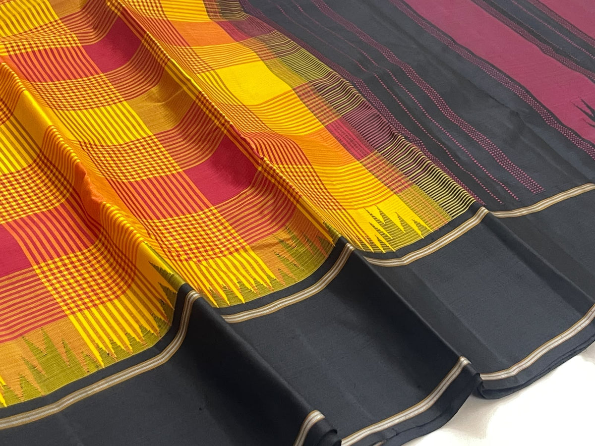 Turmeric yellow handwoven pure silk Kanjivaram Kanchi Kattam saree with black pallu, full view